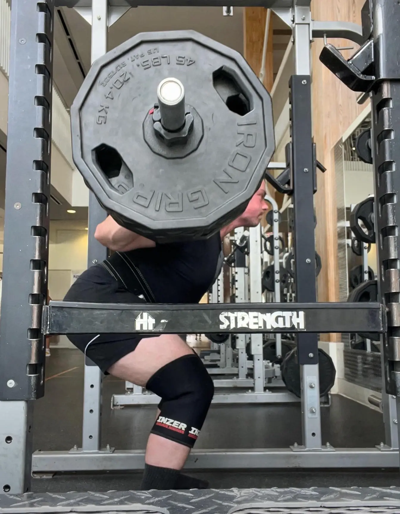 Jason Foley squatting