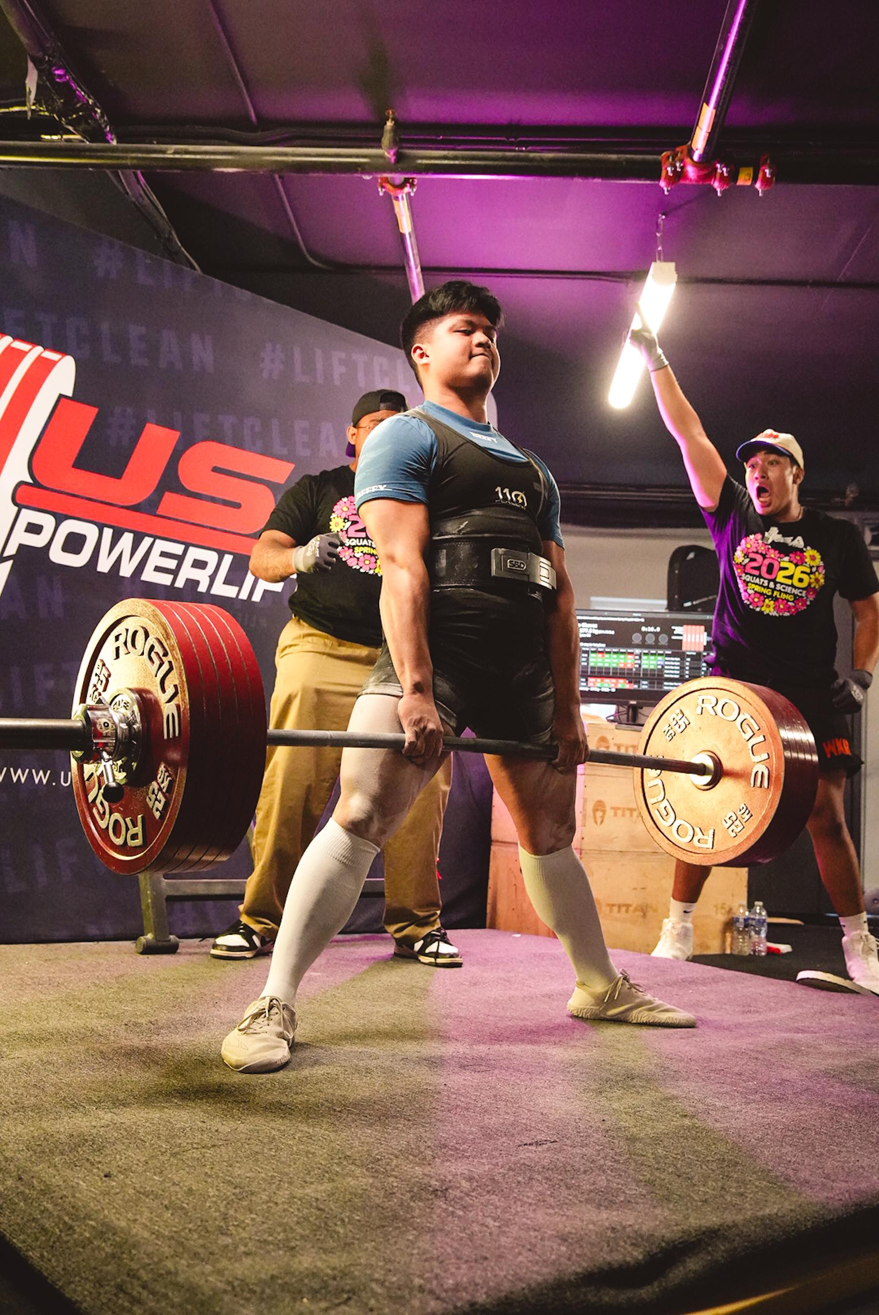 Coach competing at a USAPL meet