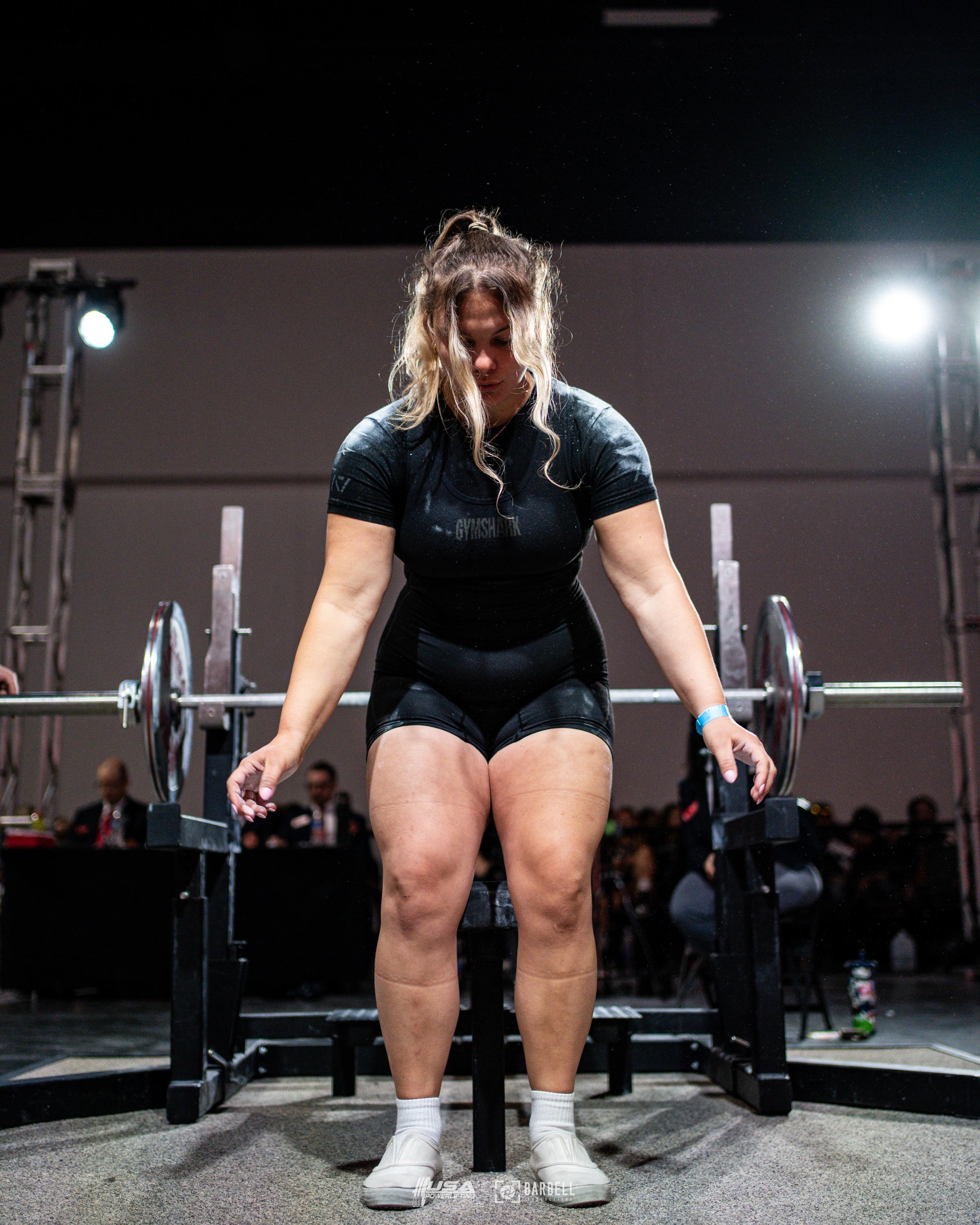 Client addressing the bar for a deadlift