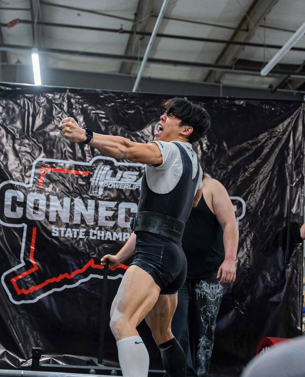 Client celebrating a lift at a state championship