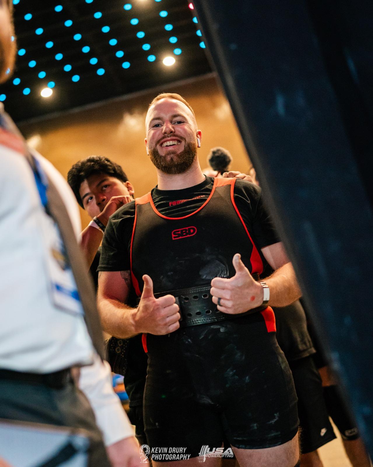 Zak Mckeon celebrating a lift at a USAPL meet